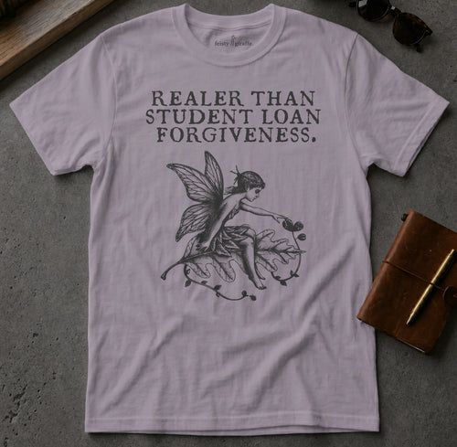 "Realer Than Student Loan Forgiveness" text with fairy design on a light purple t-shirt.