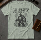 T-shirt featuring Bigfoot illustration and text "Realer Than Affordable Energy Bills".