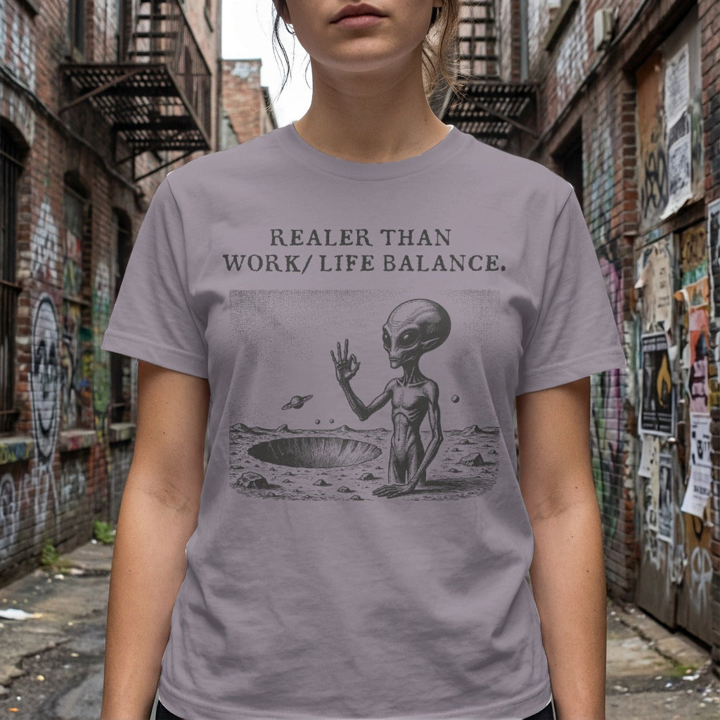 Alien in crater with text "REALER THAN WORK/LIFE BALANCE."