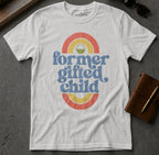 White t-shirt with "former gifted child" text and rainbow design.