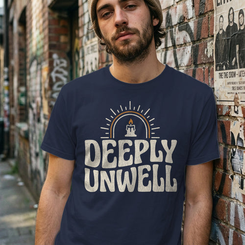 Navy t-shirt with "DEEPLY UNWELL" text and candle graphic.