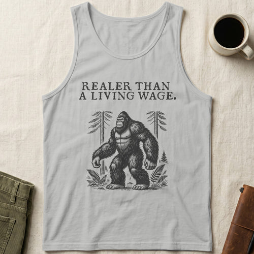Bigfoot standing in forest with "Realer Than A Living Wage" text above.