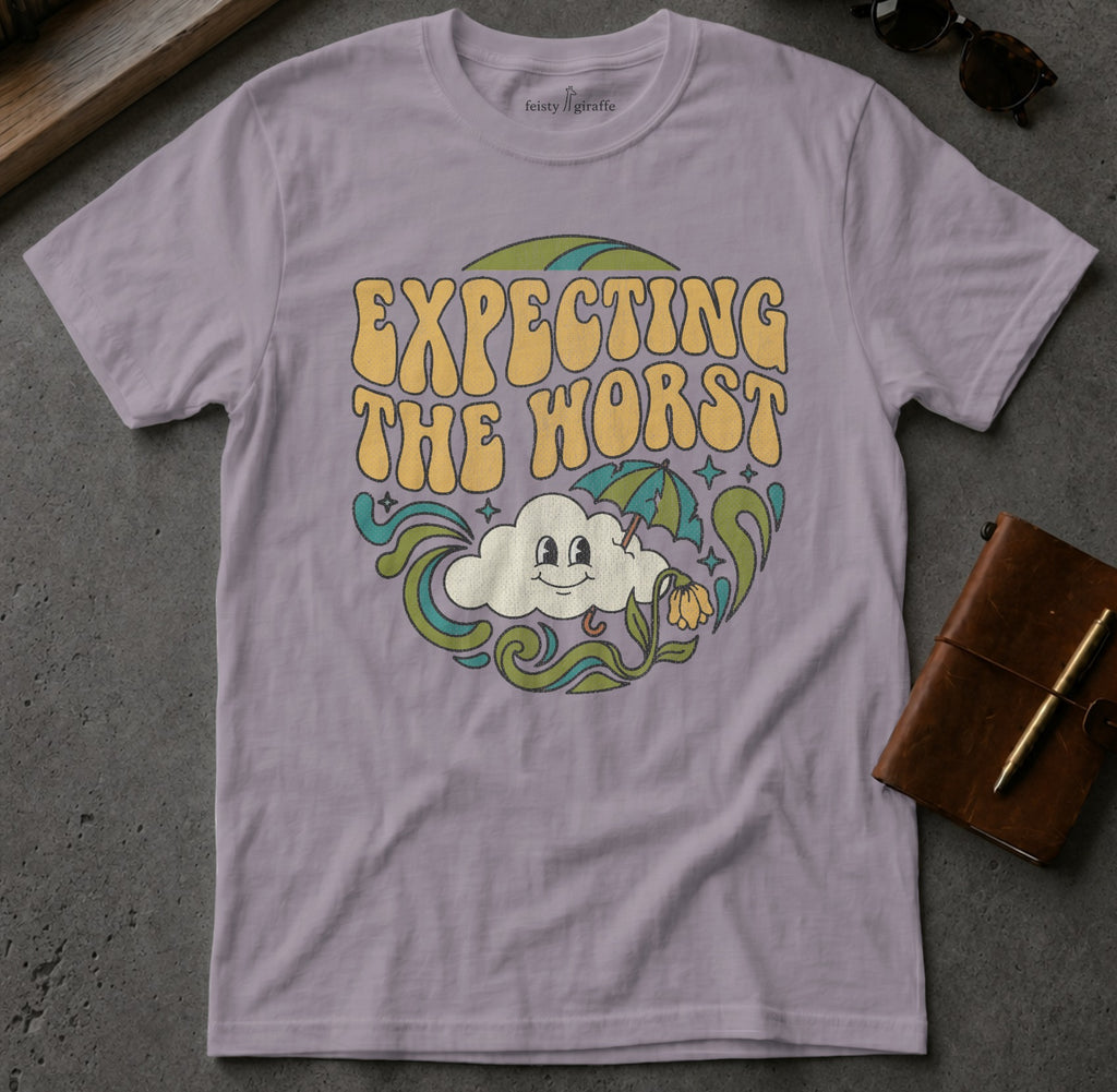Lavender t-shirt with "Expecting the Worst" text and cartoon cloud.