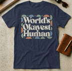 Navy t-shirt with "World's Okayest Human" text in retro geometric design.