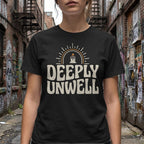 Black t-shirt with "DEEPLY UNWELL" text and a sun graphic.