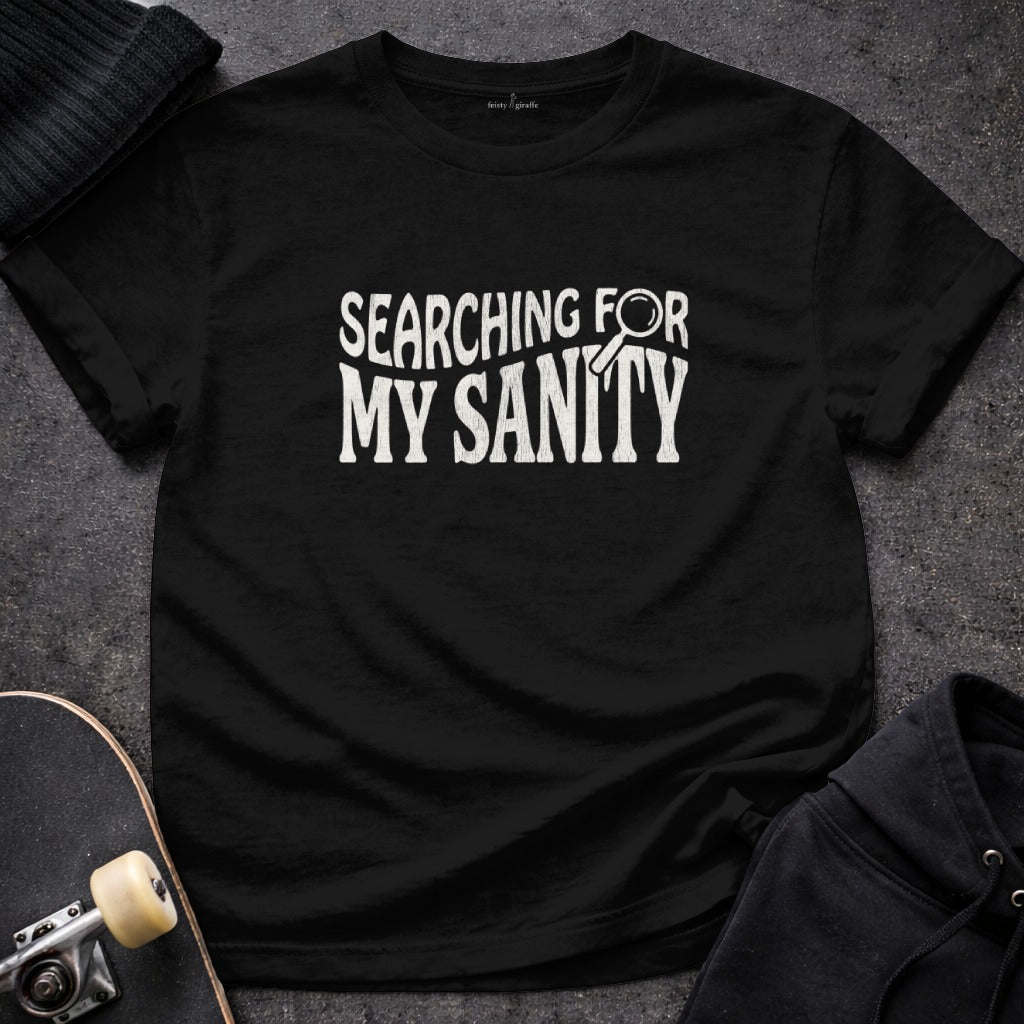 Black Searching For My Sanity Quote Design product type
T-shirt, Black tee, Sanity quote, Funny shirt, Humor, Sarcasm, Mental health, Stress, Unique design, Graphic tee, Magnifying glass, Search phrase, Personal journey, Gift idea, Apparel, Relatable, Statement piece, Dark humor, Feisty giraffe, Casual style