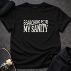 Black Searching For My Sanity Quote Design product type
T-shirt, Black tee, Sanity quote, Funny shirt, Humor, Sarcasm, Mental health, Stress, Unique design, Graphic tee, Magnifying glass, Search phrase, Personal journey, Gift idea, Apparel, Relatable, Statement piece, Dark humor, Feisty giraffe, Casual style