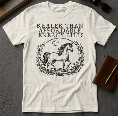 White t-shirt with a unicorn and text that reads "Realer than affordable energy bills."