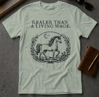 Light green t-shirt with unicorn illustration and text "REALER THAN A LIVING WAGE."