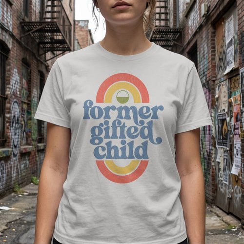 White t-shirt with "former gifted child" text and rainbow graphic.