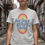 White t-shirt with "former gifted child" text and rainbow graphic.