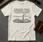 White t-shirt with "Realer than student loan forgiveness" text and Loch Ness Monster graphic.