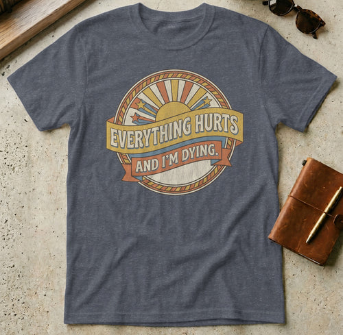 Grey t-shirt with "Everything Hurts and I'm Dying" graphic.