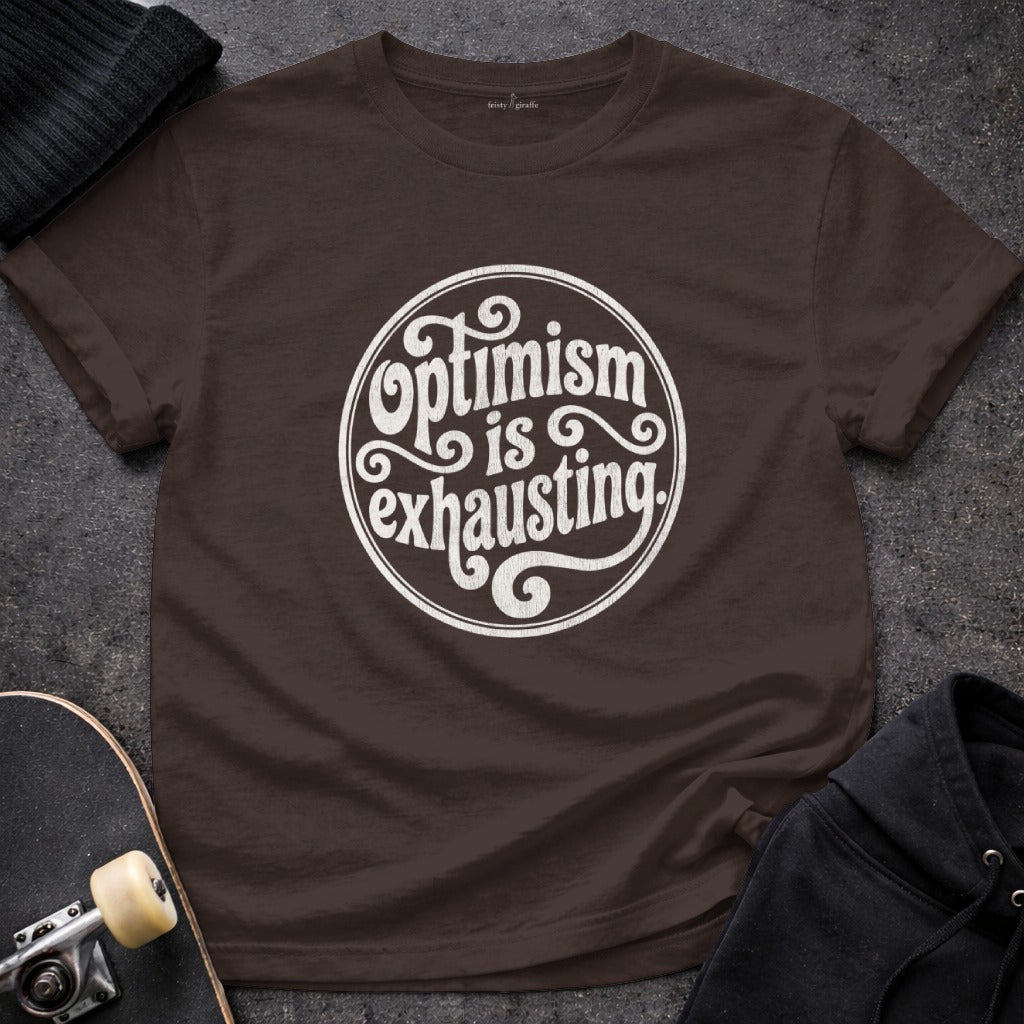 Optimism is exhausting graphic shirt product type