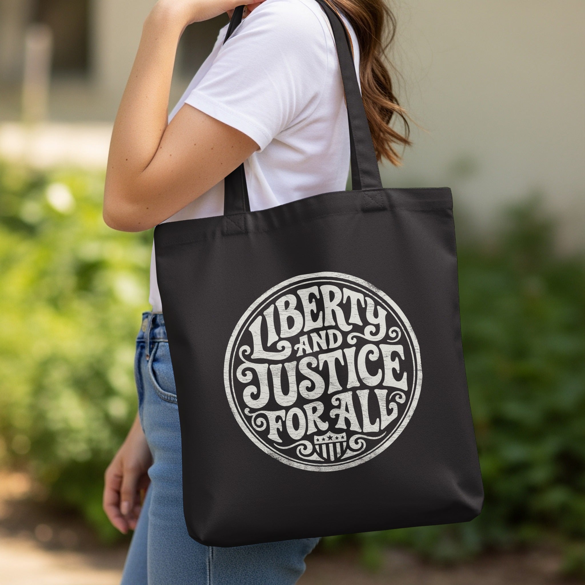Liberty And Justice For All Graphic Black Tote Bag product type
Liberty
Justice
Freedom
Equality
Patriotic
Tote Bag
Black Bag
Graphic Bag
Statement Bag
USA Theme
Rights Bag
Social Justice
Democracy
Reusable Bag
Shopping Bag
Everyday Carry
Accessories
Gift Idea
Womens Bag
Protest Slogan