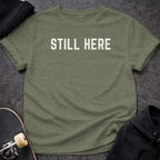 Printify T-shirt S / Heather Military Green Still Here T-Shirt