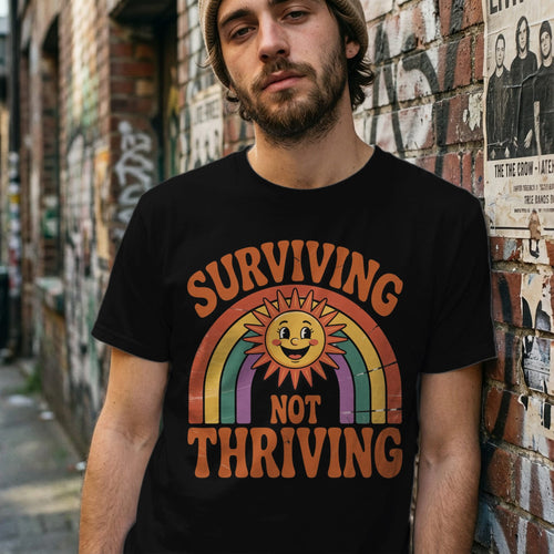 Printify t-shirt Surviving Not Thriving Tee