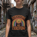 Printify t-shirt Surviving Not Thriving Tee